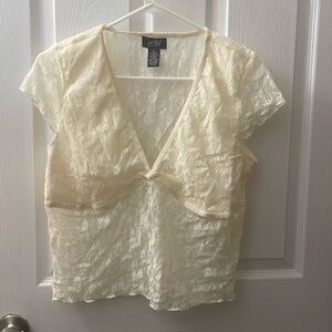 Summer clothes I never wore. 
Cream lacy t-shirt.never used.